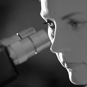 Engineer using microscope
