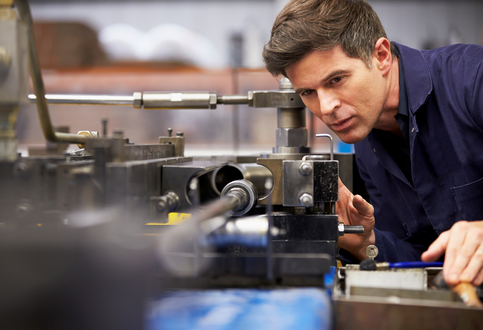 Photo of an engineer with a machine