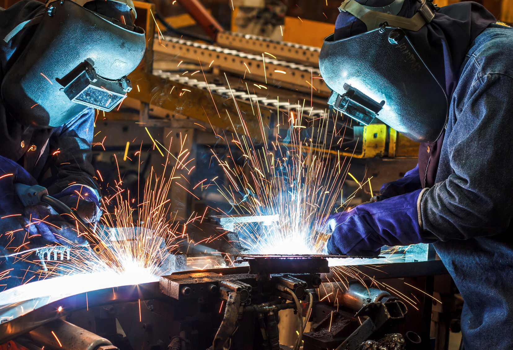 Photo of 2 welders at work